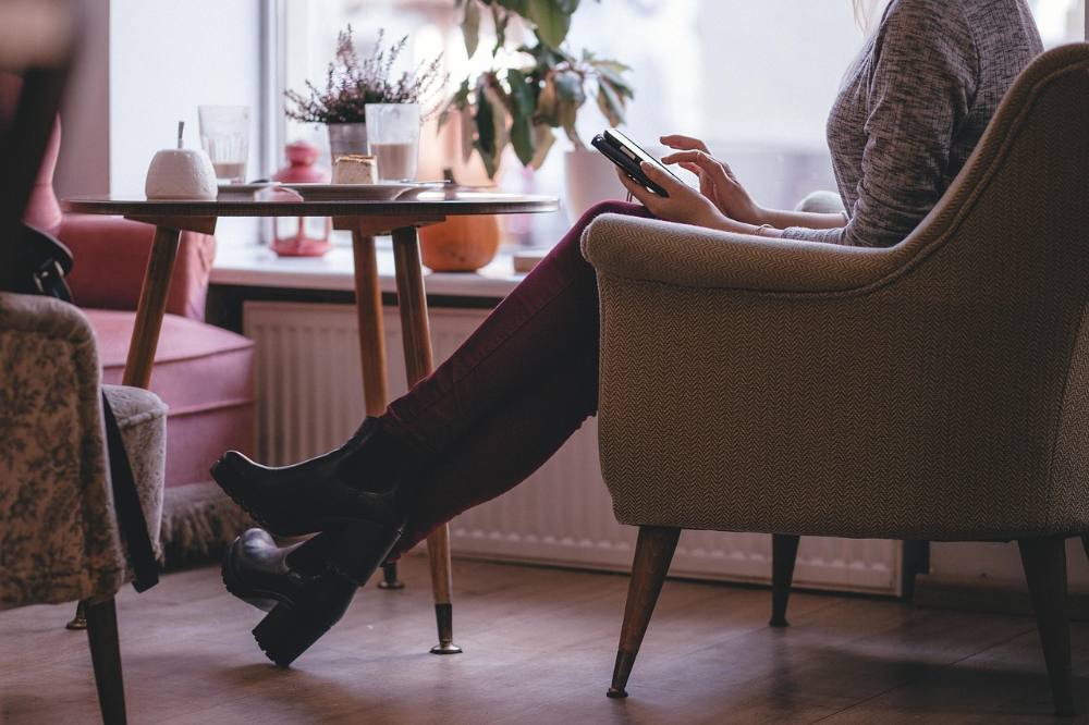 A woman pausing for a moment of calm during a busy day.